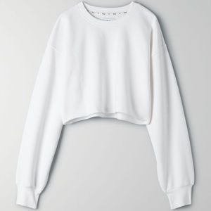 Aritzia TnaCozy Fleece Boyfriend Cropped Sweatshirt in white.